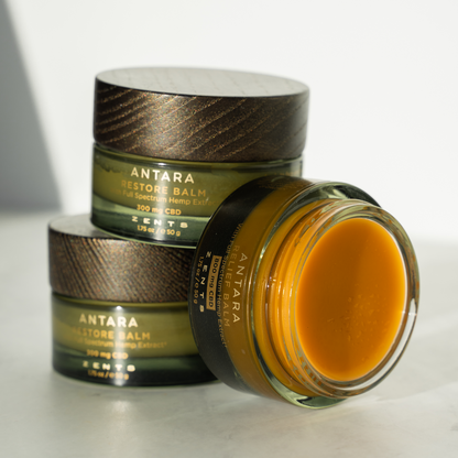 Three jars of balm with Relief Balm lid off